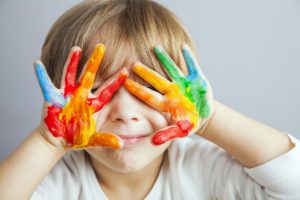 Child with paint on his hands