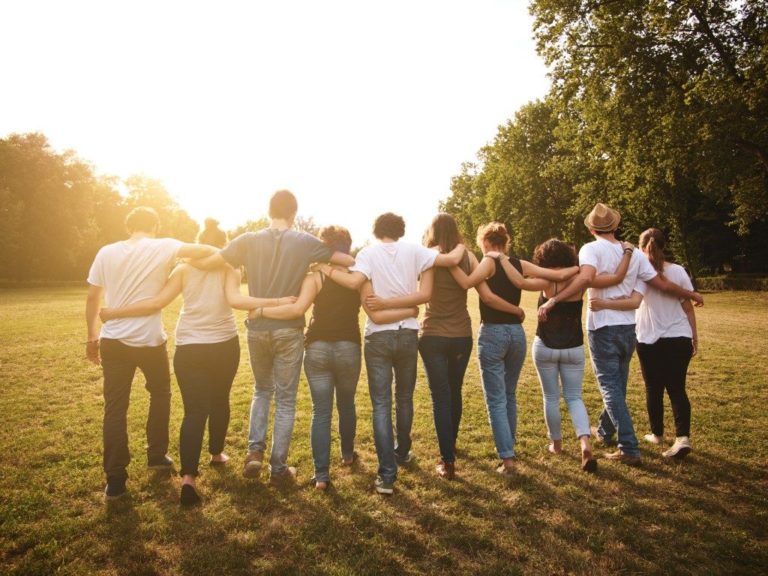 Group of friends walking in the park