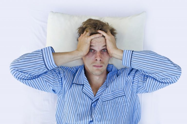 man having difficulties sleeping