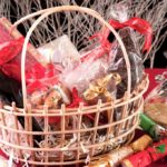 Christmas hamper basket with a chocolate Santa, cookies and a bottle of wine