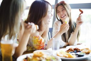 Group of friends laughing at a restaurant