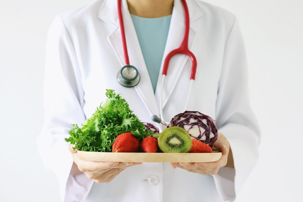 Doctor holding a tray of healthy food