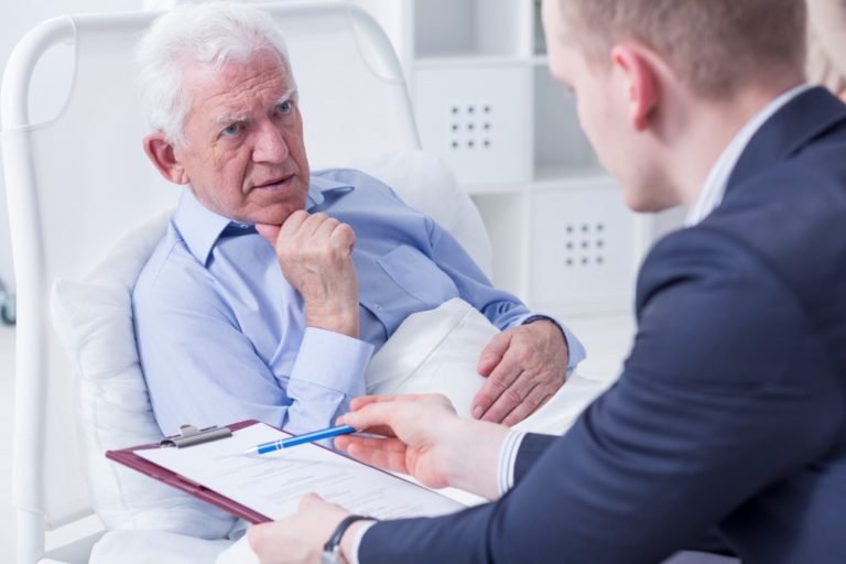 old man being treated in a hospice