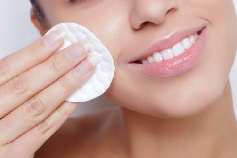 Woman using makeup wipes to remove makeup