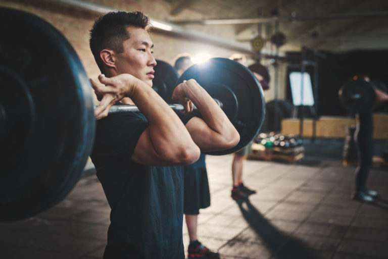 man lifting weights