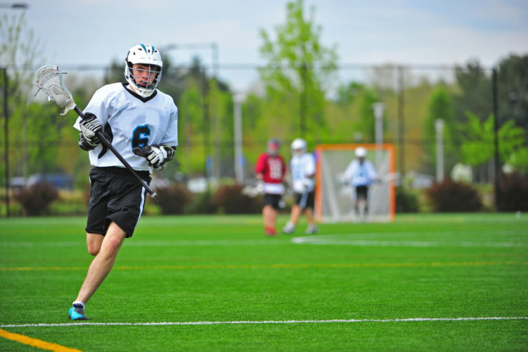 man playing lacrosse