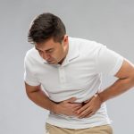 man having pain in his stomach