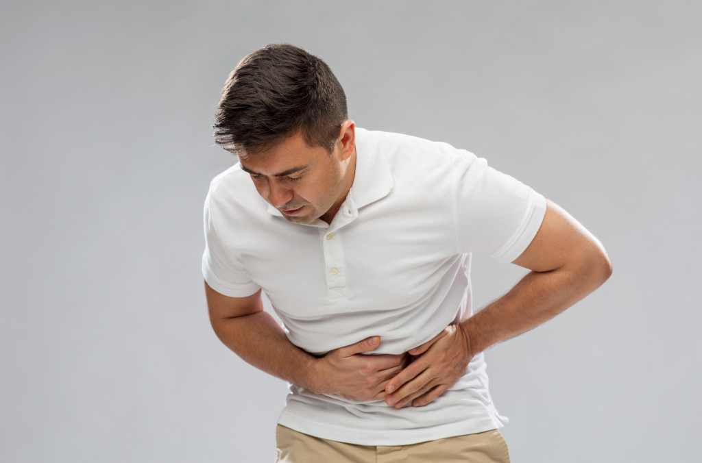 man having pain in his stomach
