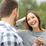 confident woman talking to a man