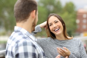 confident woman talking to a man