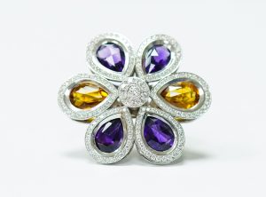 diamond ring with blue and yellow gemstones