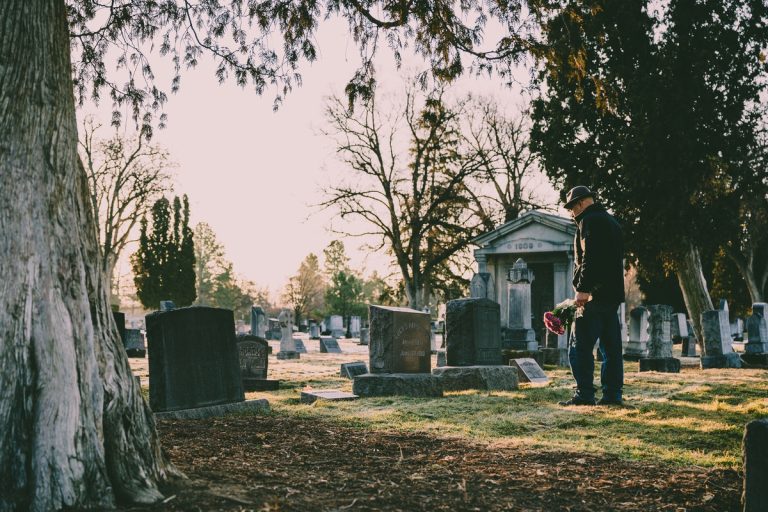 a person grieving in the cemetery