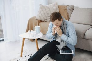 man suffering from allergy