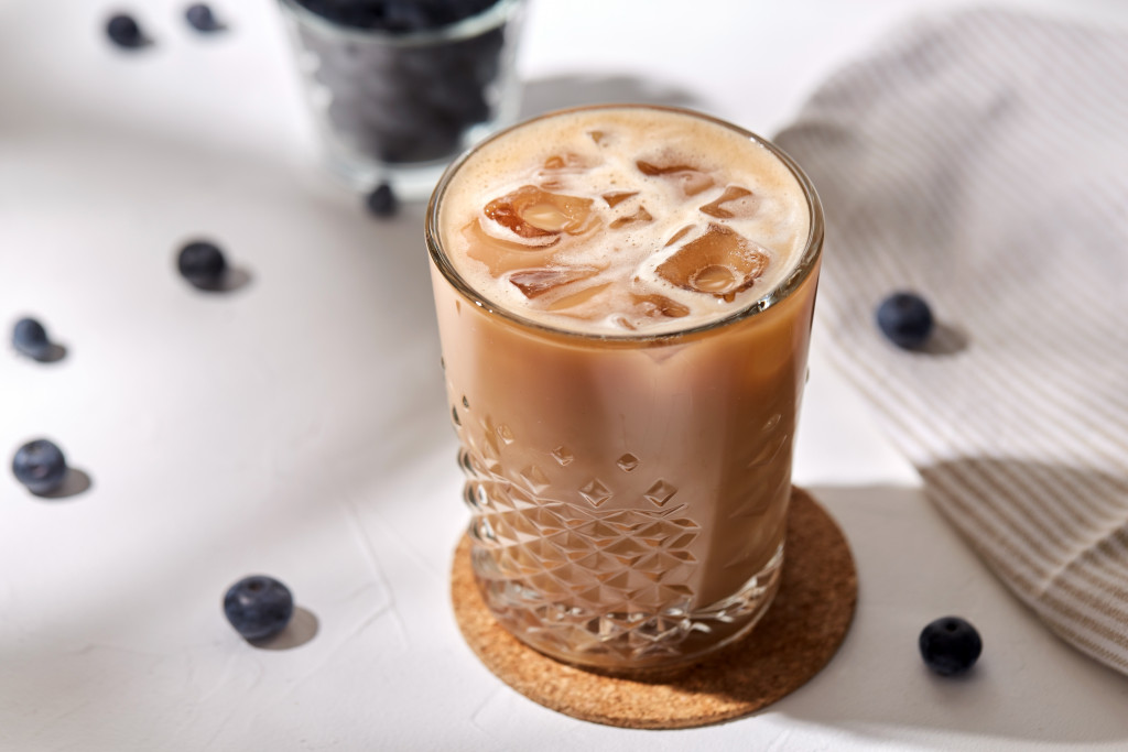 Iced coffee glass on a coaster